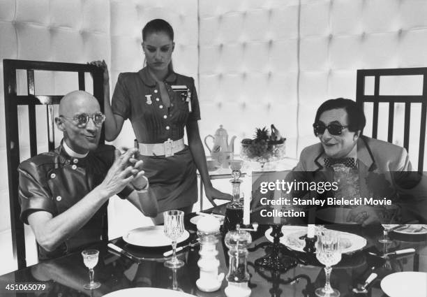 Actors Richard O'Brien, Barry Humphries and Nell Campbell in a scene from the film 'Shock Treatment', 1981.