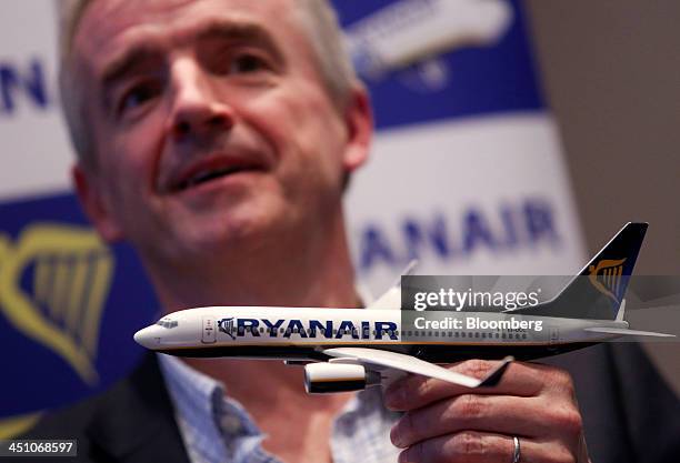 Michael O'Leary, chief executive officer of Ryanair Holdings Plc, holds a model aircraft as he speaks during a news conference in London, U.K., on...