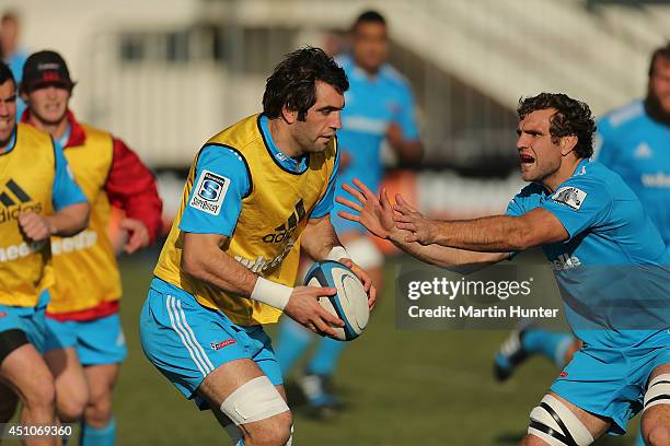 Sam Whitelock is tackled by Luke Whitelock during a Crusaders Super Rugby training session at Rugby Park on June 23, 2014 in Christchurch, New...