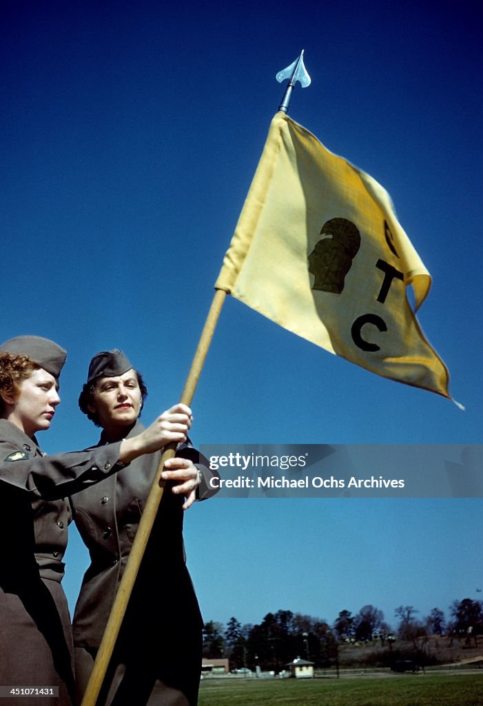 A view as women is color guard holds the flag at the Women's Army ...
