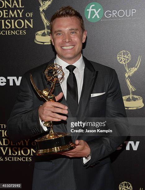 Actor Billy Miller poses in the press room with the Outstanding Lead Actor in a Drama Series award for "The Young and the Restless" during The 41st...