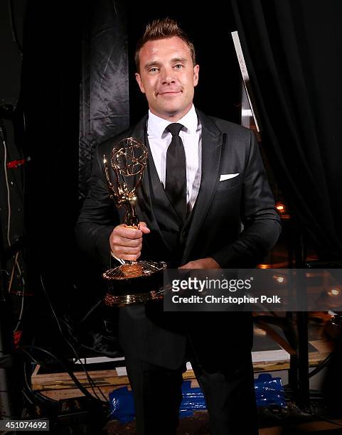 Actor Billy Miller poses with the Outstanding Lead Actor in a Drama Series for 'The Young and the Restless' backstage at The 41st Annual Daytime Emmy...