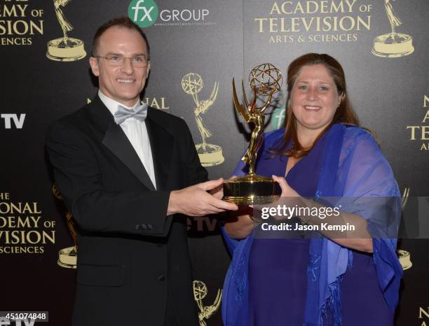 Personality Guillermo Arduino and producer Magdalena Cabral poses with the Outstanding Entertainment Program in Spanish for 'Clix' Award in the press...