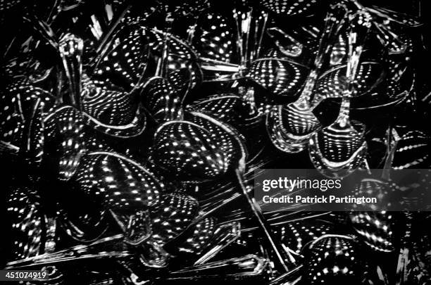 Close-up of spoons on a cafeteria tray as they reflect the ceiling lights of the McCormick Place convention center, Chicago, Illinois, 1972.