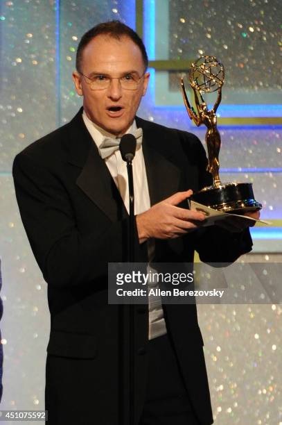 Personality Guillermo Arduino accepts an Emmy Award for Outstanding Entertainment Program in Spanish for 'Clix' onstage during the 41st Annual...