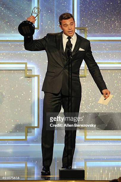 Actor Billy Miller accepts and Emmy Award for Outstanding Lead Actor in a Drama Series for 'The Young and the Restless' onstage during the 41st...