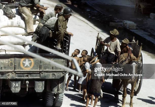 View of an Sicilian children greeting Allied troops after the invasion of Sicily, called Operation Husky, during the World War II in Palermo, Sicily,...