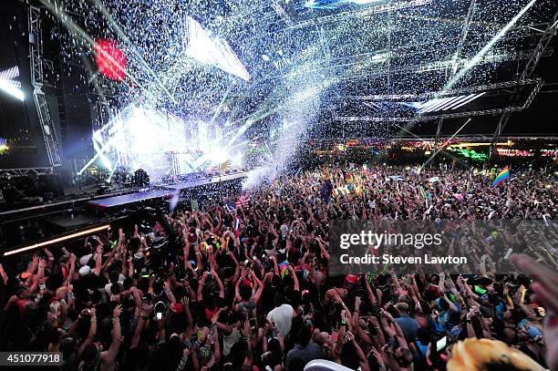 The crowd reacts as Calvin Harris performs at the 18th annual Electric Daisy Carnival at Las Vegas Motor Speedway on June 22, 2014 in Las Vegas,...