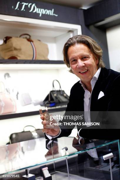 Alain Crevet, CEO of the ST Dupont luxury company, poses on November 21, 2013 in Paris. AFP PHOTO / THOMAS SAMSON