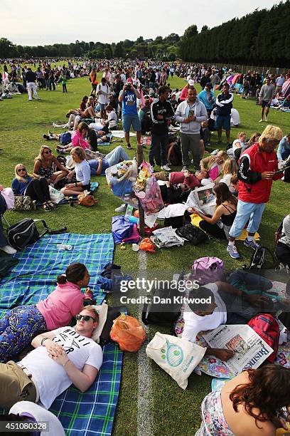 Spectators queue outside before the start of day one of the Wimbledon Lawn Tennis Championships at the All England Lawn Tennis and Croquet Club at...