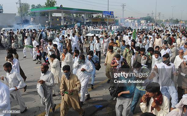 Clash Between Police And Pakistan Awami Tehreek Supporters Photos and ...