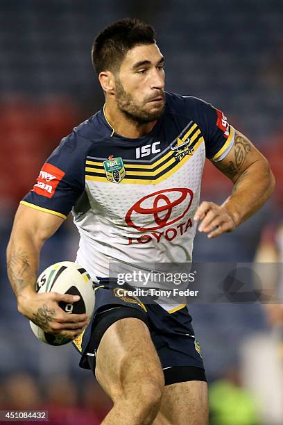 James Tamou of the Cowboys runs with the ball during the round 15 NRL match between the Newcastle Knights and the North Queensland Cowboys at Hunter...