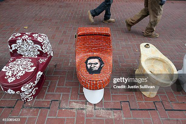 Decorated toilets are displayed as part of a public art installation titled "C'mon, give a shit" to mark World Toilet Day and to bring attention to a...