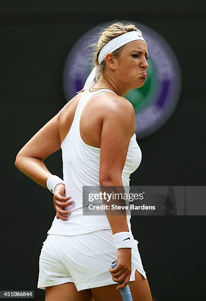 Victoria Azarenka of Belarus reacts during her Ladies' Singles first round match against Mirjana Lucic-Baroni on day one of the Wimbledon Lawn Tennis...