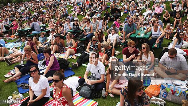 Fans of Andy Murray gather on 'Murray Mount' to watch the Gentlemen's Singles first round match between Andy Murray of Great Britain and David Goffin...