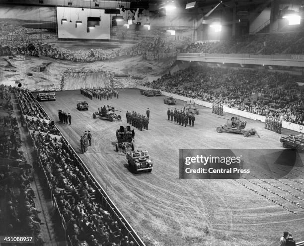 View as R.A.F. With mobile AA guns, RAF band and jeeps with trailers during final rehearsal for the Royal Tournament at Earls Court in London,...