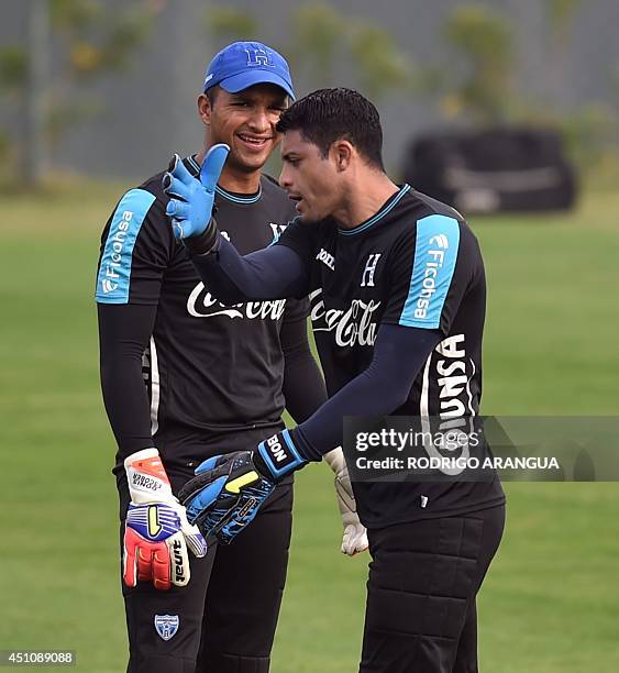 Honduras' goalkeepers Donis Escober and Noel Valladares attend a training session in Porto Feliz during the 2014 FIFA World Cup football tournament...