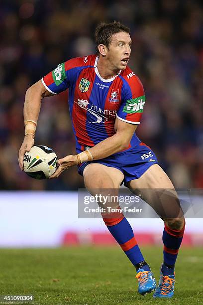 Kurt Gidley of the Knights prepares to pass the ball during the round 15 NRL match between the Newcastle Knights and the North Queensland Cowboys at...