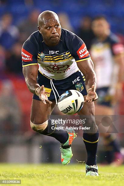 Robert Lui of the Cowboys passes the ball during the round 15 NRL match between the Newcastle Knights and the North Queensland Cowboys at Hunter...