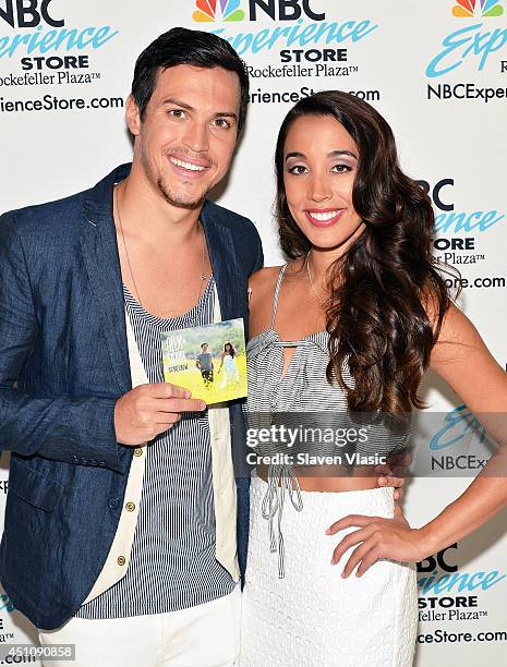 Singers Alex Kinsey and Sierra Deaton of Alex & Sierra attend the Alex and Sierra "Scarecrow" CD signing at NBC Experience Store on June 23, 2014 in...