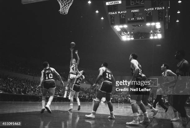 Los Angeles Lakers Jerry West in action, shot vs Cincinnati Royals Jack Twyman at Los Angeles Sports Arena. Jerry West with face taped for broken...