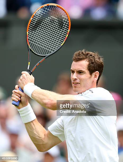 Andy Murray of Great Britain returns the ball during his Gentlemen's Singles first round match against David Goffin of Belgium during the Wimbledon...