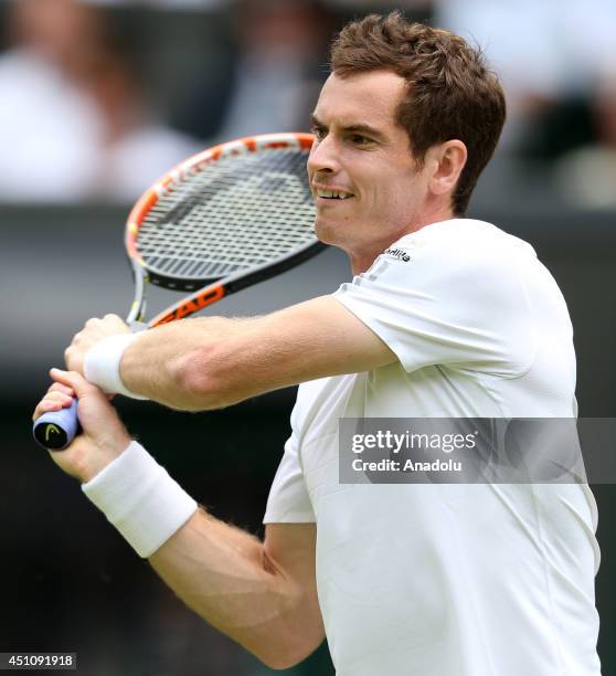 Andy Murray of Great Britain returns the ball during his Gentlemen's Singles first round match against David Goffin of Belgium during the Wimbledon...