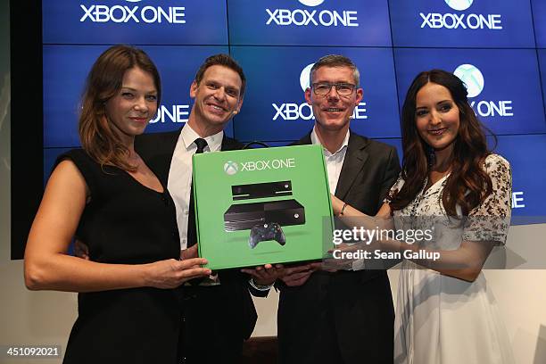 Actress Jessica Schwarz , Microsoft Germany Consumer Channel Group General Manager Oliver Kaltner, Microsoft Germany head Christian Illek and Johanna...