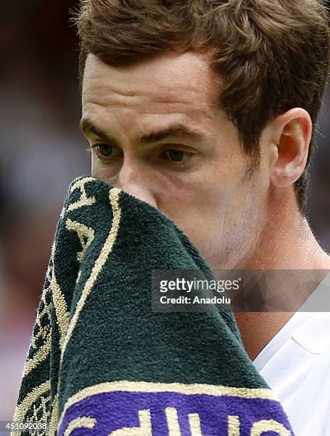 Andy Murray of Great Britain reacts during his Gentlemen's Singles first round match against David Goffin of Belgium on day one of the Wimbledon Lawn...