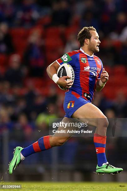 Tyrone Roberts of the Knights runs the ball during the round 15 NRL match between the Newcastle Knights and the North Queensland Cowboys at Hunter...