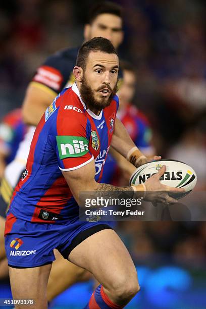 Darius Boyd of the Knights runs the ball during the round 15 NRL match between the Newcastle Knights and the North Queensland Cowboys at Hunter...