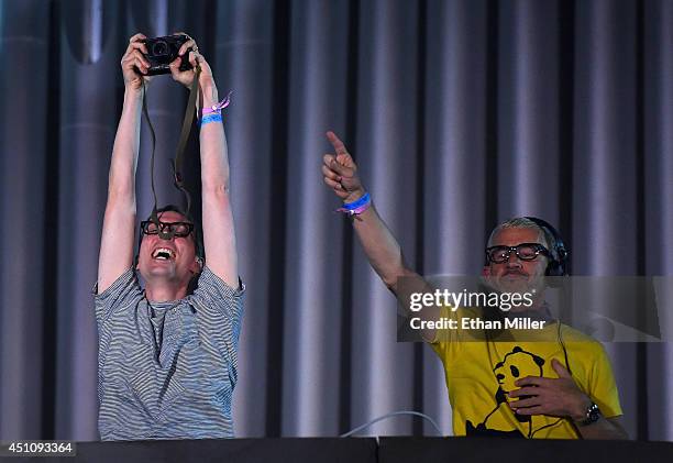Recording artist Paavo Siljamaki takes a photo of the crowd as he and Tony McGuinness of Above & Beyond perform during the 18th annual Electric Daisy...
