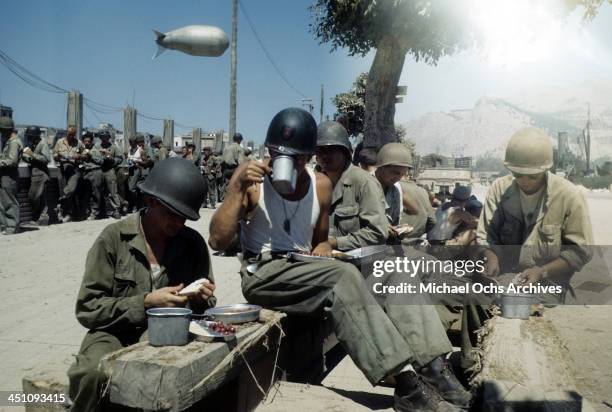 View of an Allied troops eating outside after the invasion of Sicily, 5 days after the campaign called Operation Husky, during the World War II in...