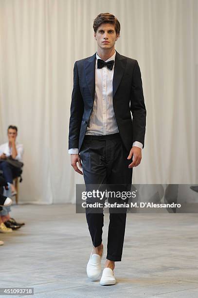 Model walks the runway during the Messagerie show as part of Milan Fashion Week Menswear Spring/Summer 2015 on June 23, 2014 in Milan, Italy.