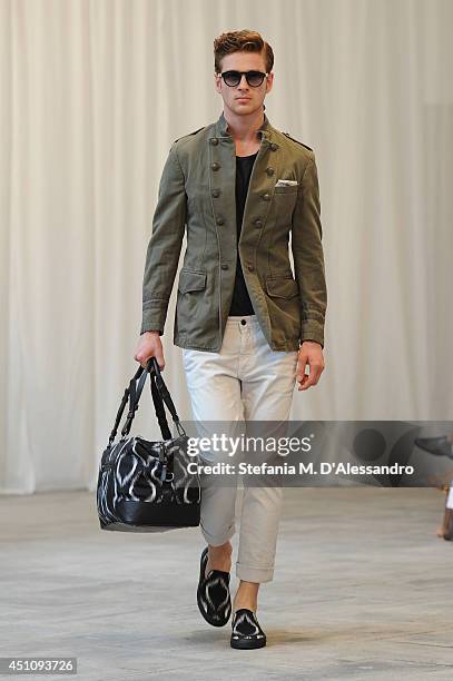 Model walks the runway during the Messagerie show as part of Milan Fashion Week Menswear Spring/Summer 2015 on June 23, 2014 in Milan, Italy.