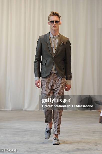 Model walks the runway during the Messagerie show as part of Milan Fashion Week Menswear Spring/Summer 2015 on June 23, 2014 in Milan, Italy.