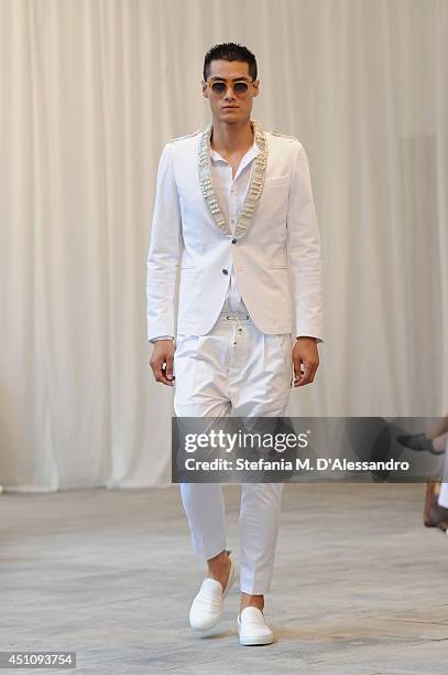 Model walks the runway during the Messagerie show as part of Milan Fashion Week Menswear Spring/Summer 2015 on June 23, 2014 in Milan, Italy.