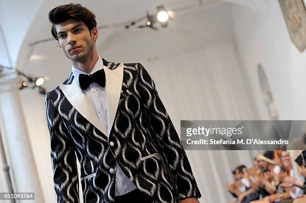 Model walks the runway during the Messagerie show as part of Milan Fashion Week Menswear Spring/Summer 2015 on June 23, 2014 in Milan, Italy.