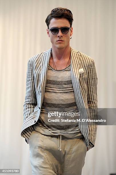 Model walks the runway during the Messagerie show as part of Milan Fashion Week Menswear Spring/Summer 2015 on June 23, 2014 in Milan, Italy.