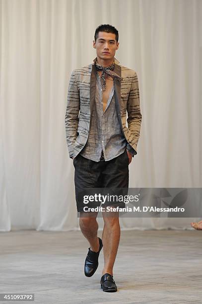 Model walks the runway during the Messagerie show as part of Milan Fashion Week Menswear Spring/Summer 2015 on June 23, 2014 in Milan, Italy.