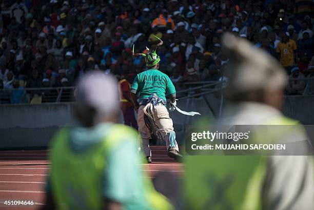 Striking South African platinum miner dances at the Royal Bafokeng stadium near the northwestern town of Rustenburg, some 200 km northwest of...