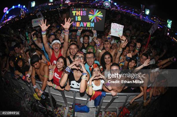 Fans react as Above & Beyond performs during the 18th annual Electric Daisy Carnival at Las Vegas Motor Speedway on June 23, 2014 in Las Vegas,...