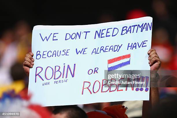 The Netherlands fan holds a banner prior to the 2014 FIFA World Cup Brazil Group B match between the Netherlands and Chile at Arena de Sao Paulo on...