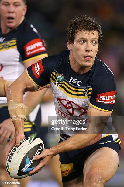 Rory Kostjasyn of the Cowboys looks to pass the ball during the round 15 NRL match between the Newcastle Knights and the North Queensland Cowboys at...