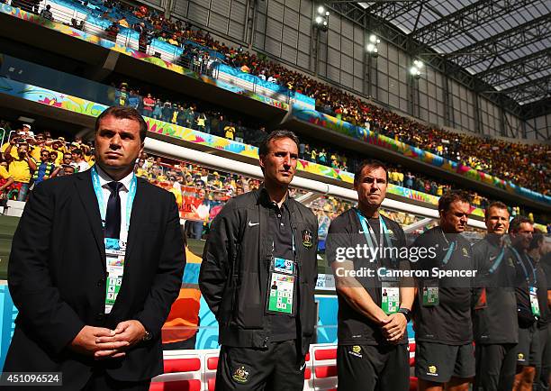 Head coach Ange Postecoglou of Australia looks on with his staff prior to the 2014 FIFA World Cup Brazil Group B match between Australia and Spain at...