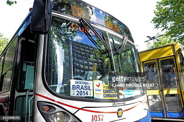 Bus of Montevideo's public transportation system displays a placard reading "Destination Brazil 2014" referring to Uruguay's qualification for the...