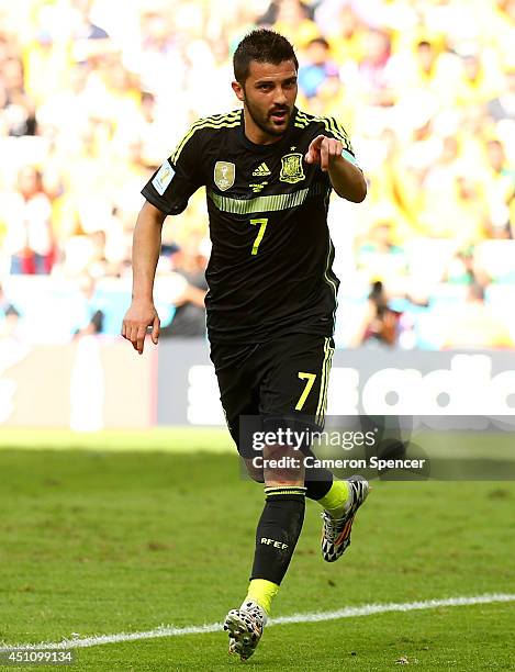 David Villa of Spain celebrates scoring his team's first goal during the 2014 FIFA World Cup Brazil Group B match between Australia and Spain at...