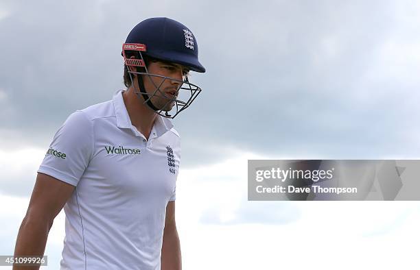 England captain Alastair Cook makes his way back to the pavilion after he was bowled out by Dhammika Prasad of Sri Lanka during day four of the 2nd...