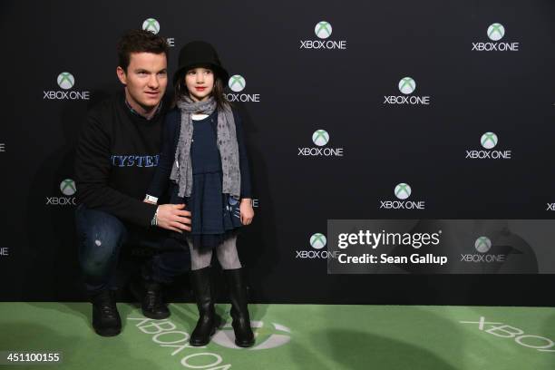 Hertha BSC football player Alexander Baumjohann and his daughter Melissa attend the Microsoft Xbox One launch party at the Microsoft Center on...