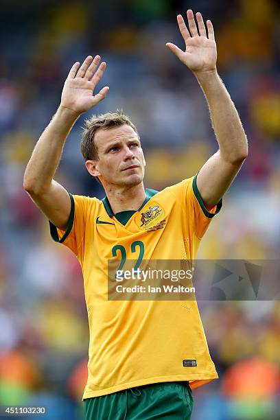 Alex Wilkinson of Australia acknowledges the fans after being defeated by Spain 3-0 during the 2014 FIFA World Cup Brazil Group B match between...